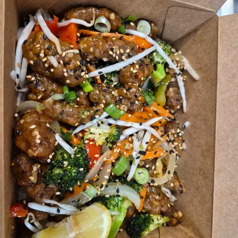 Crispy ginger beef over rice
